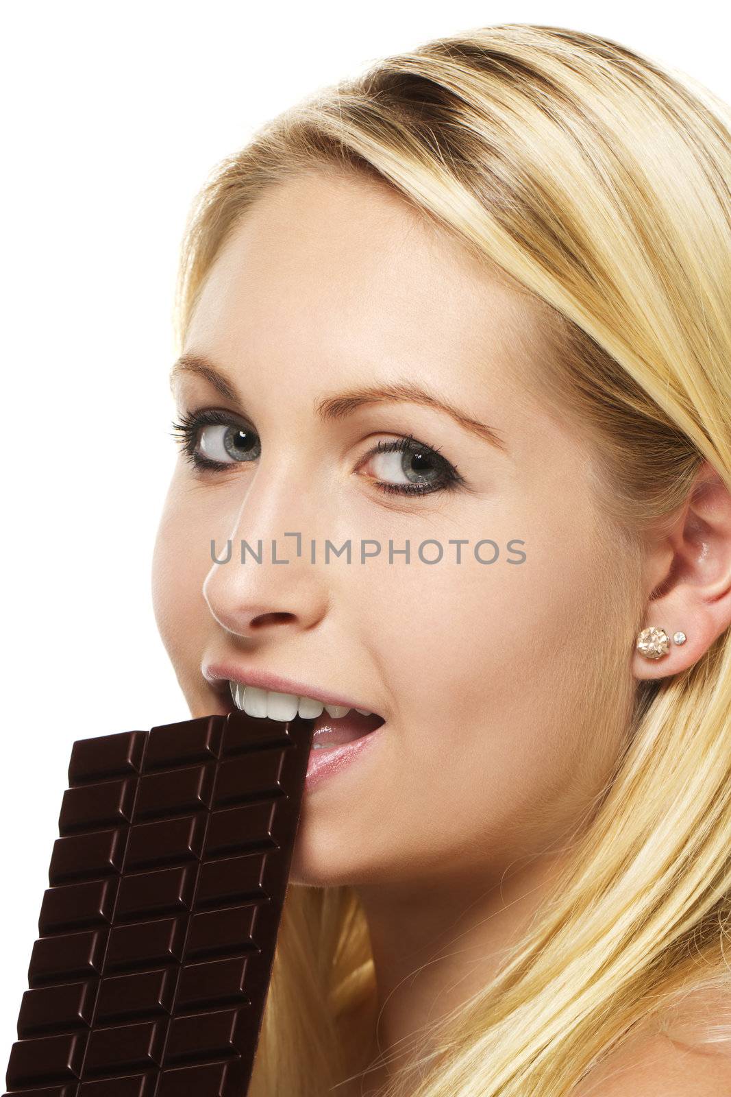beautiful blonde woman eating chocolate on white background