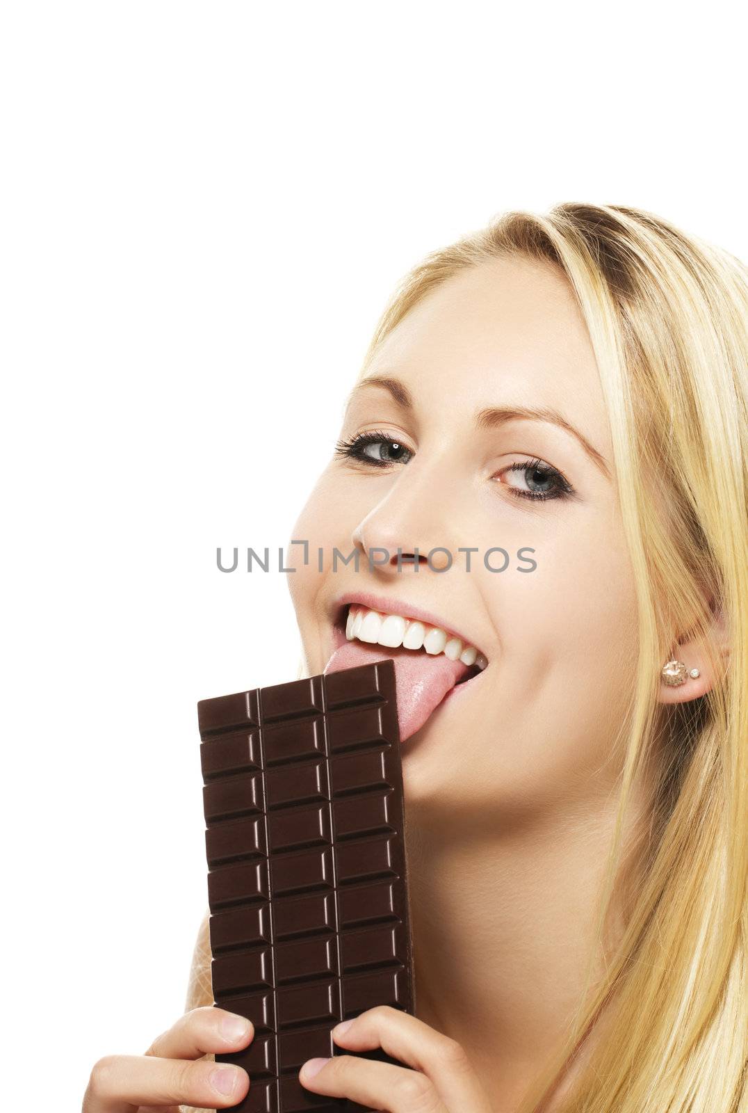 beautiful blonde woman licking on a chocolate bar on white background