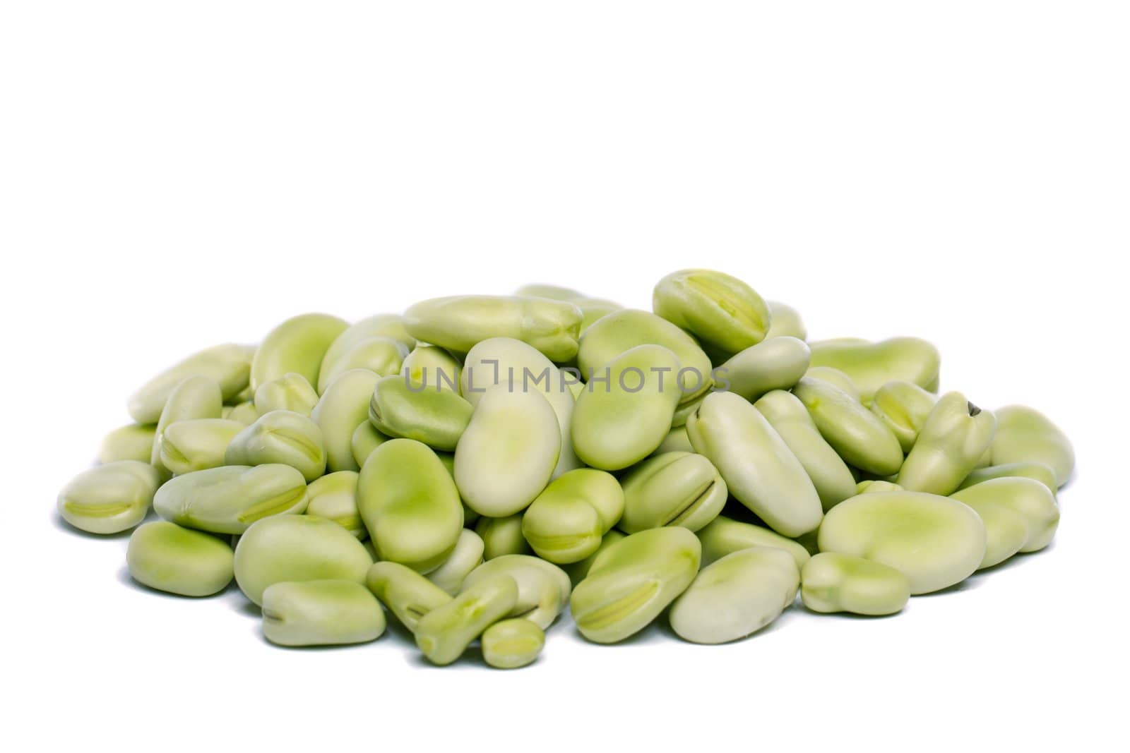 Close up view of some broad beans isolated on a white background.