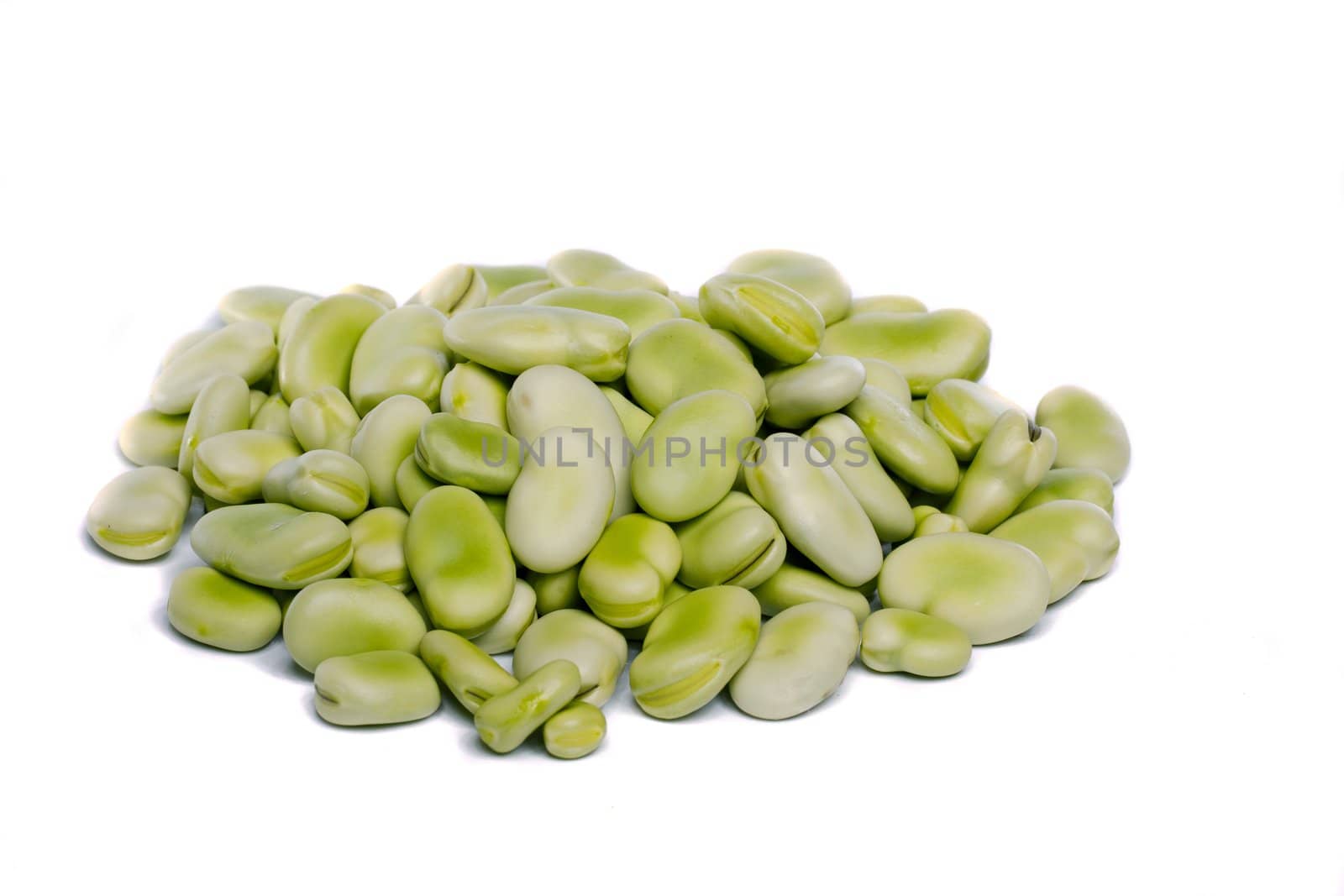 Close up view of some broad beans isolated on a white background.