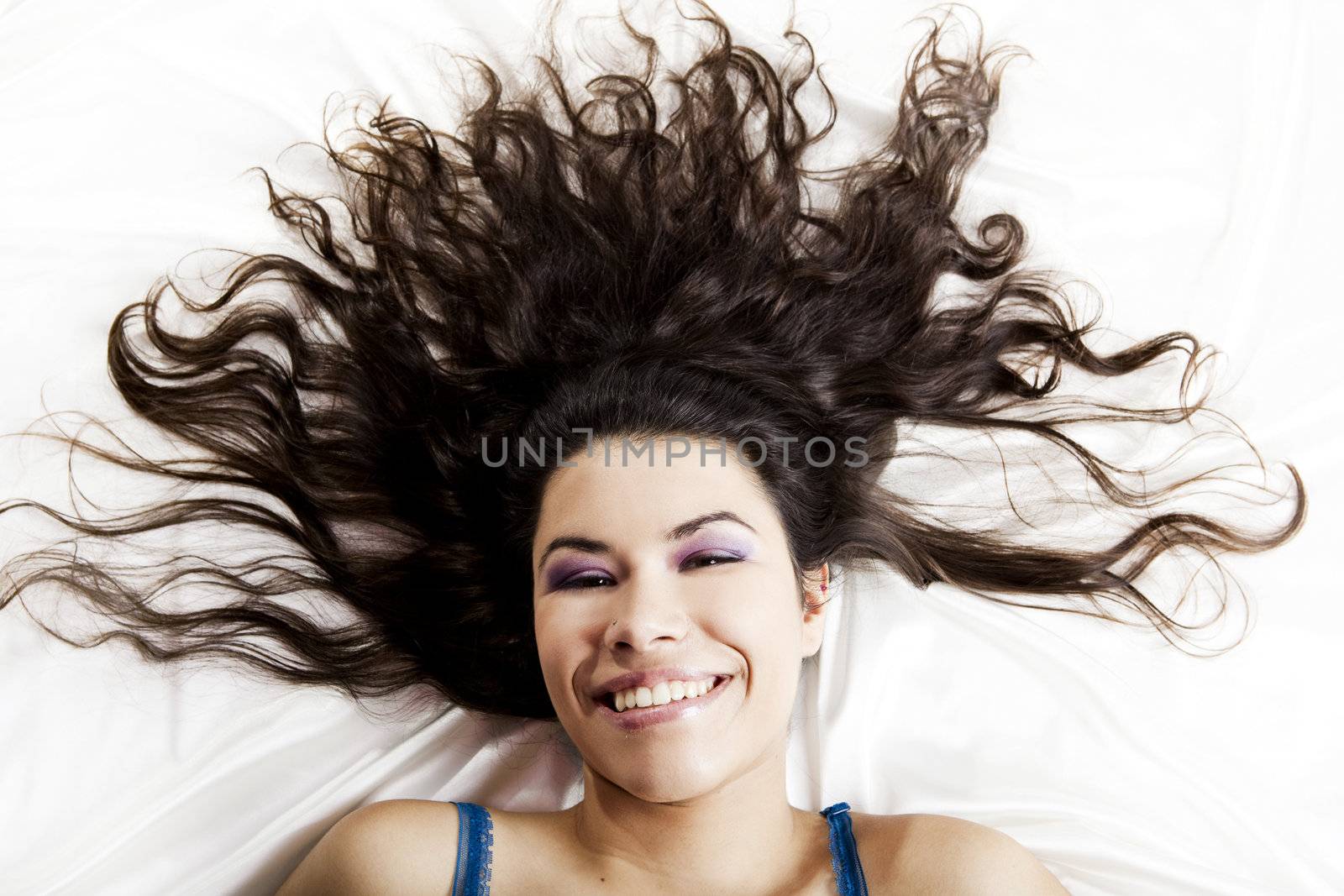 Top view portrait of a beautiful young woman smiling