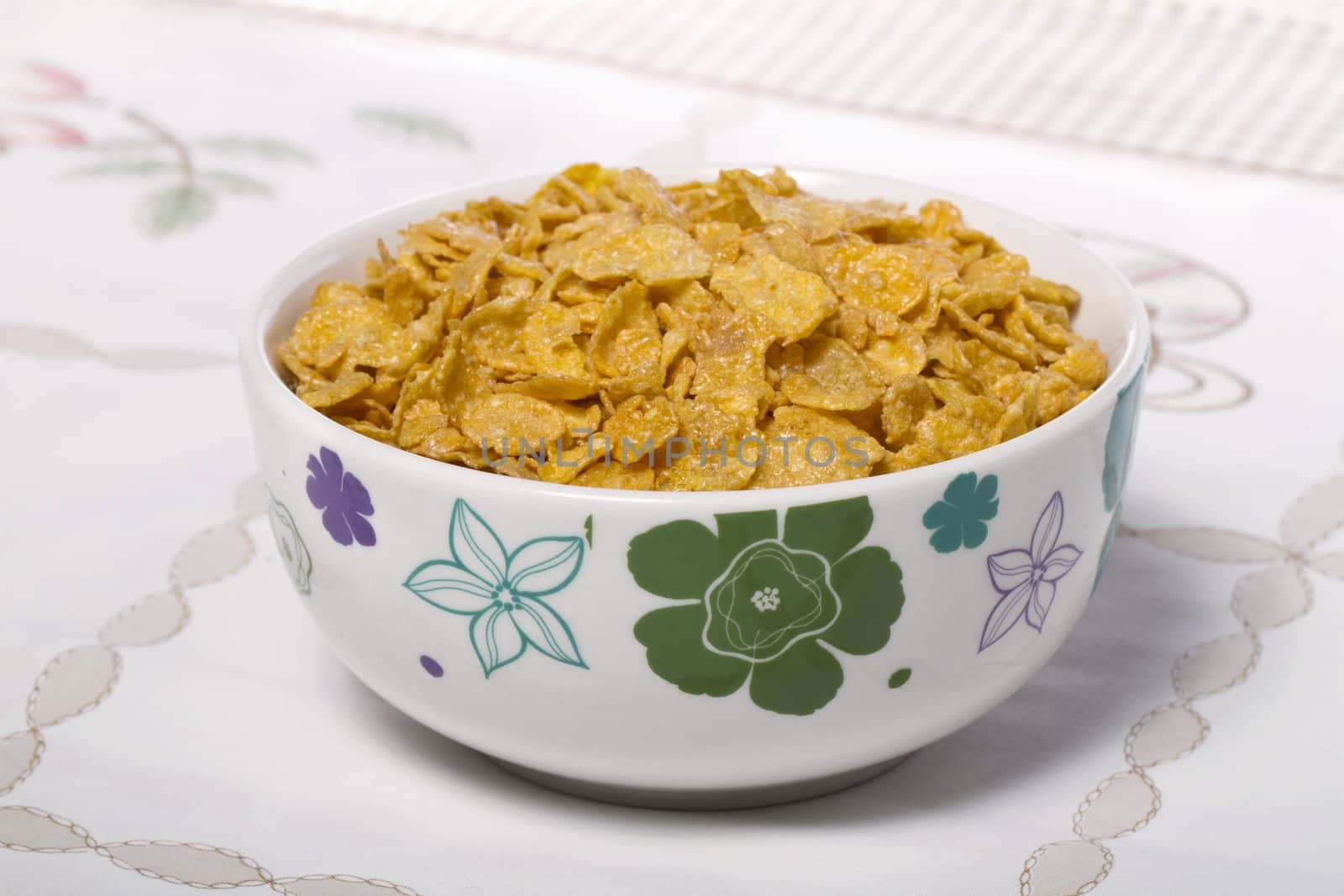 View of a bowl of cereals on top of a table.