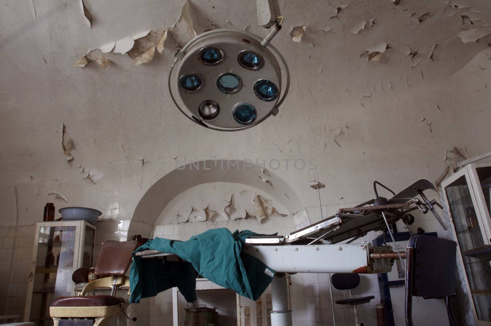 Old and abrased surgery room with equipment