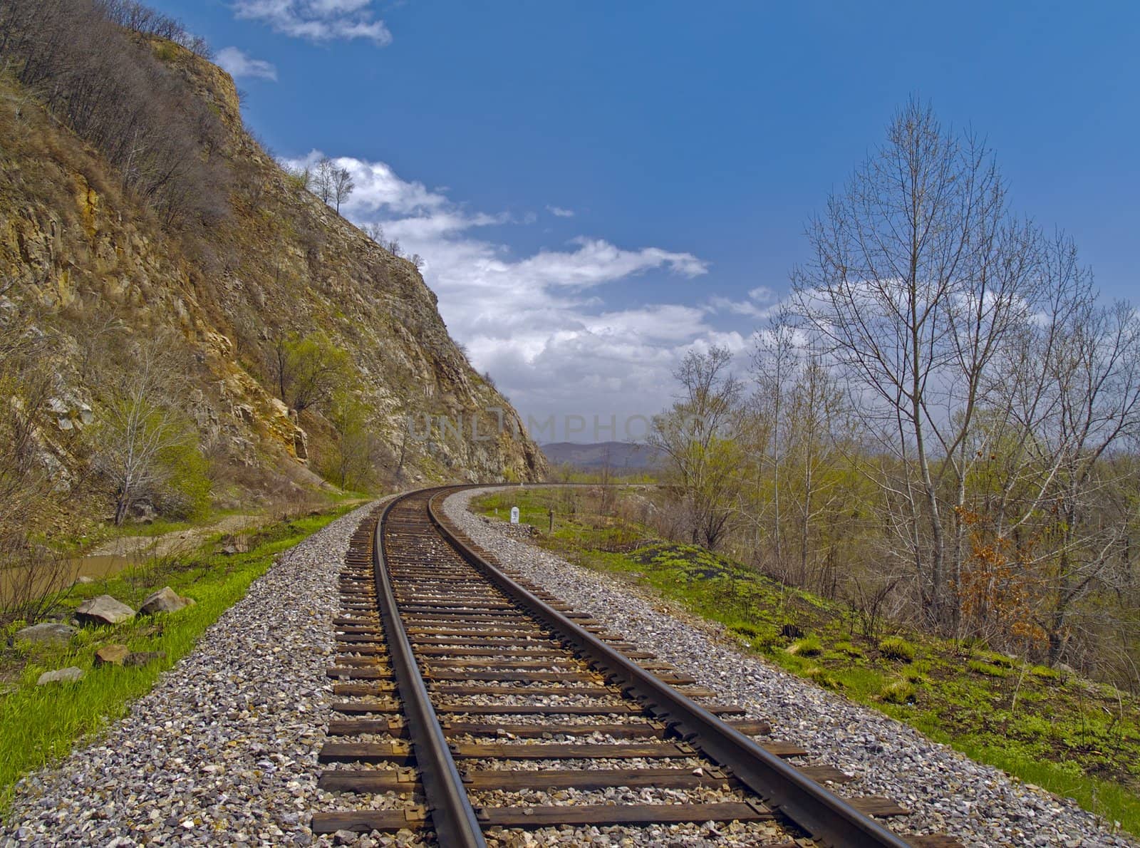 The Tumbling of railway linen beside declivity of mountain