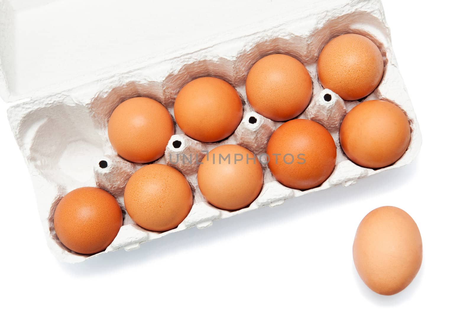 Ten fresh eggs isolated on white