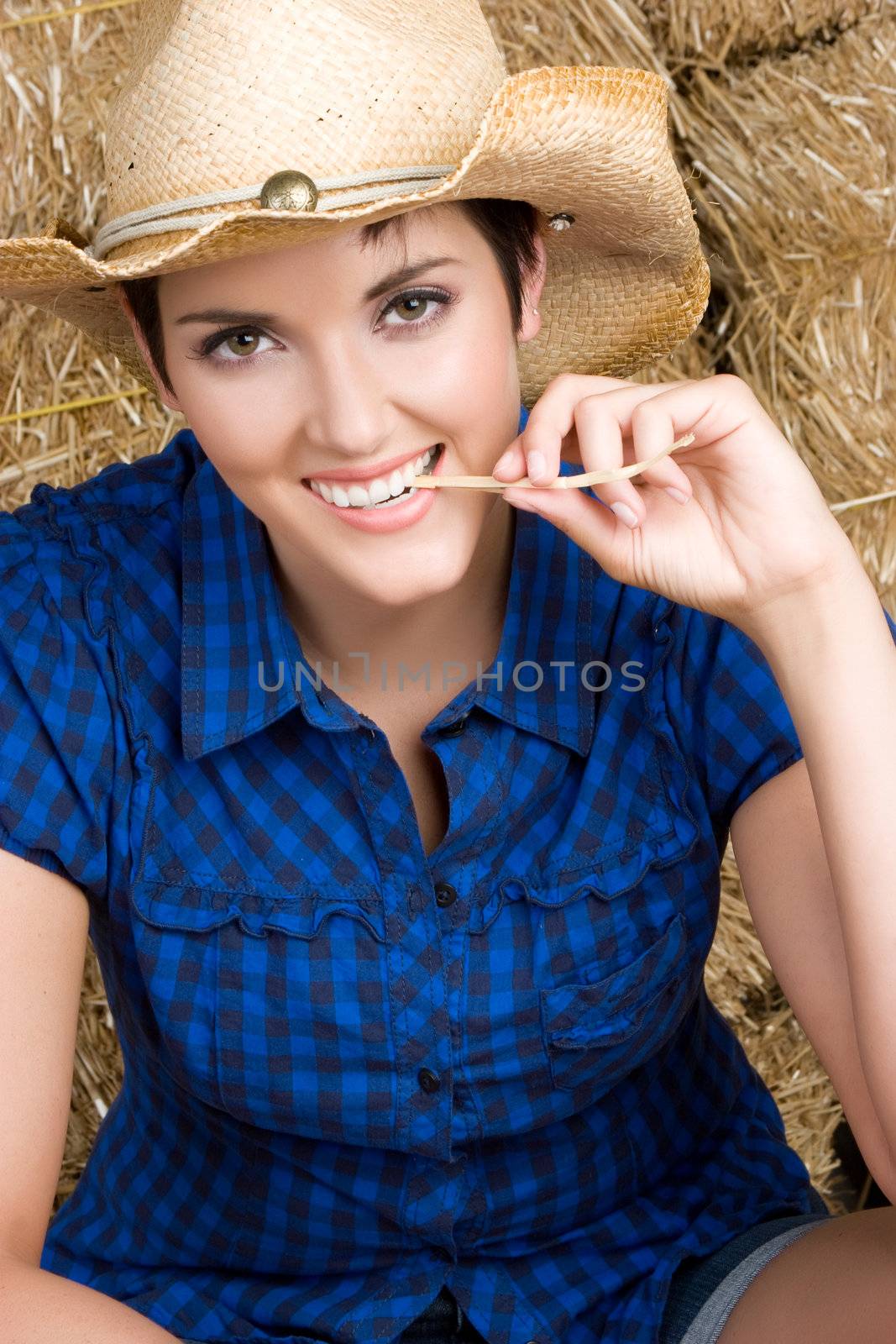 Beautiful country girl in hay