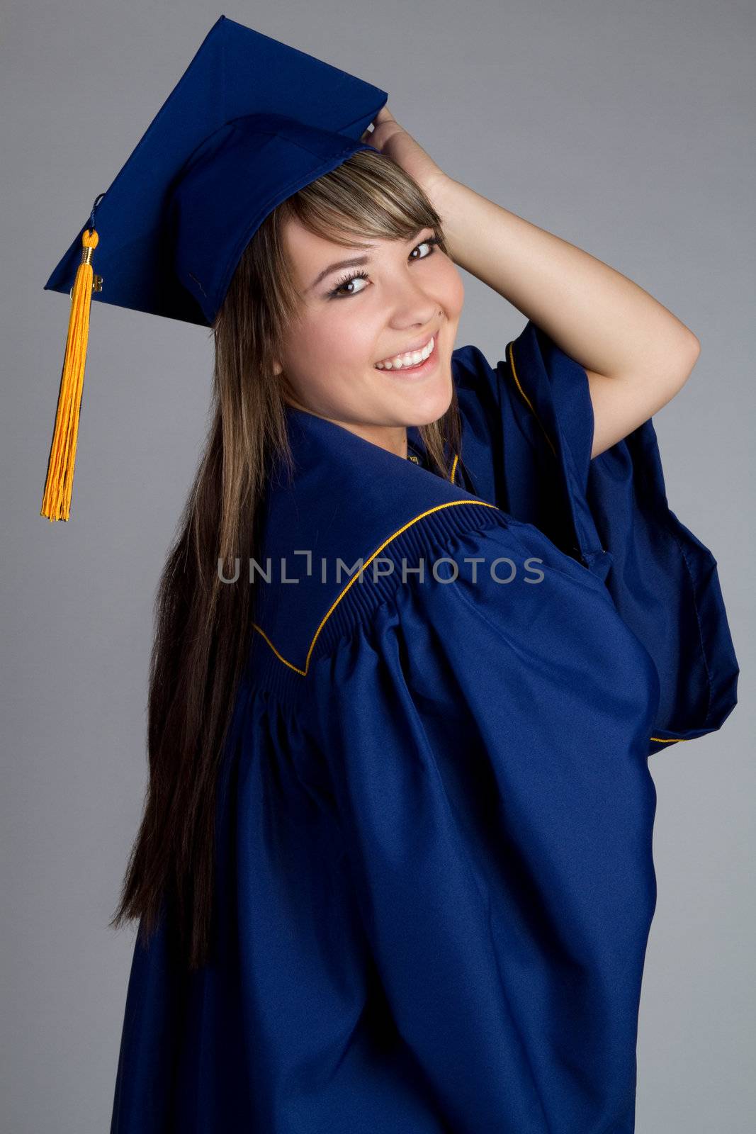 Smiling high school girl graduating