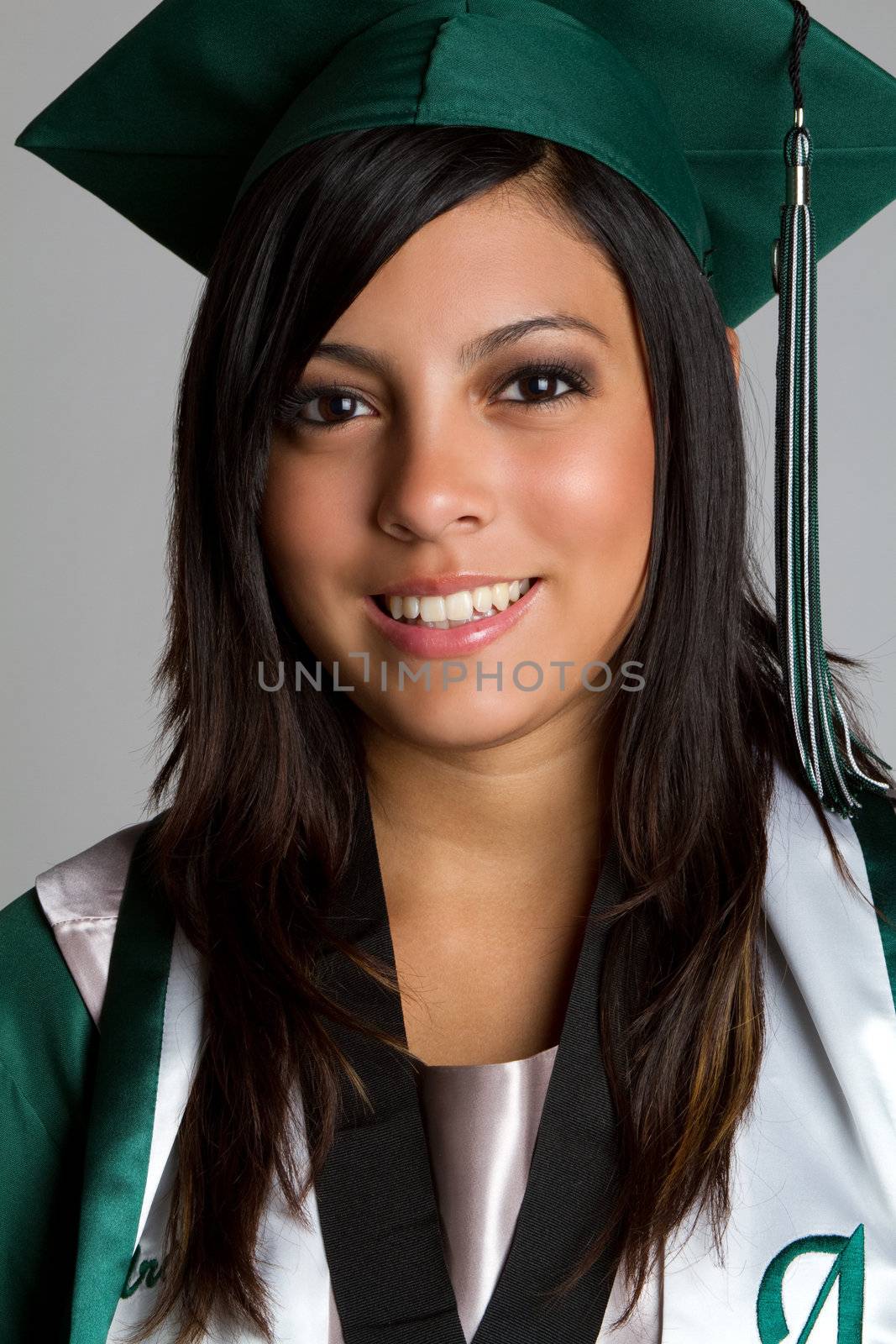 Hispanic high school graduate smiling