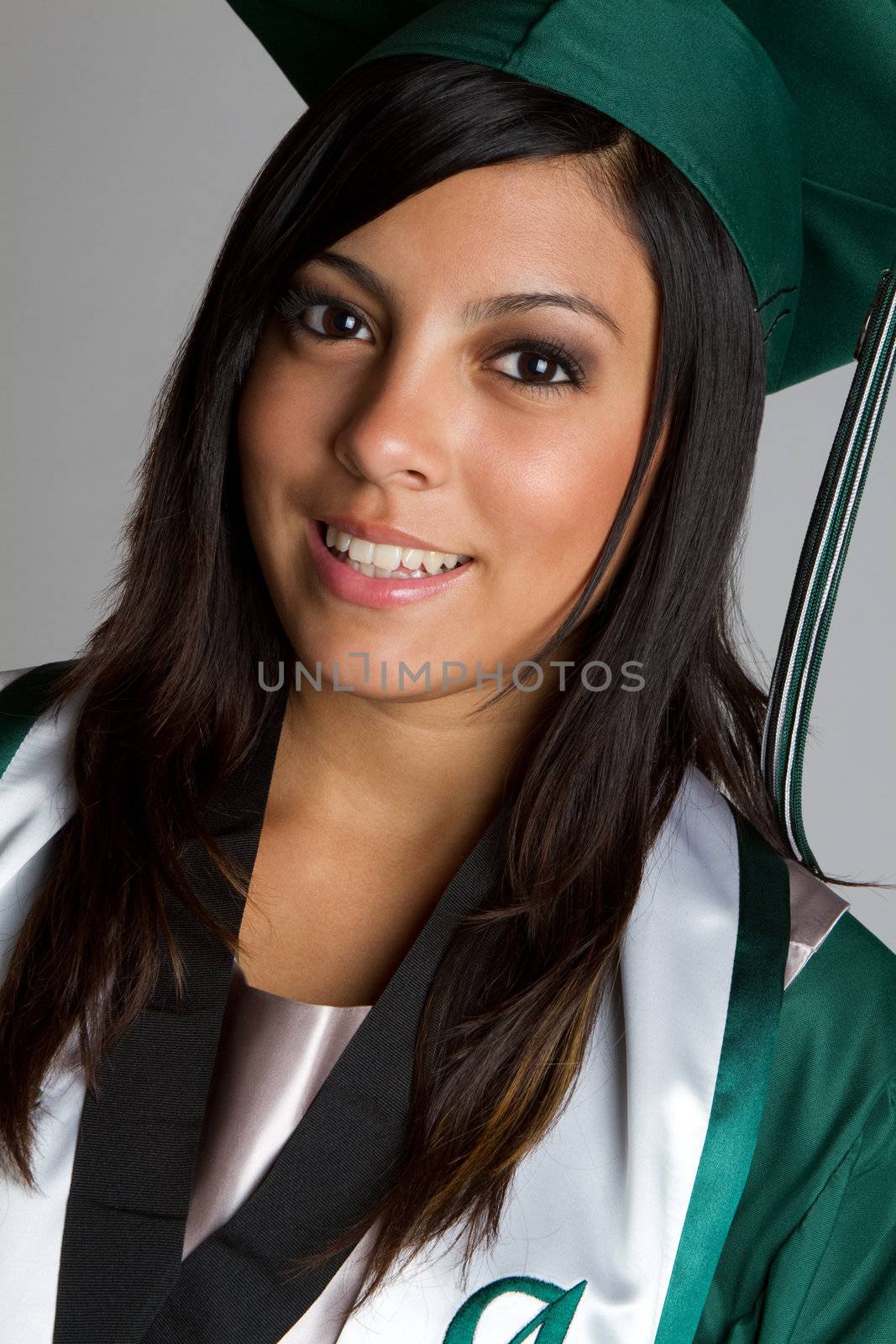 Smiling hispanic high school graduate