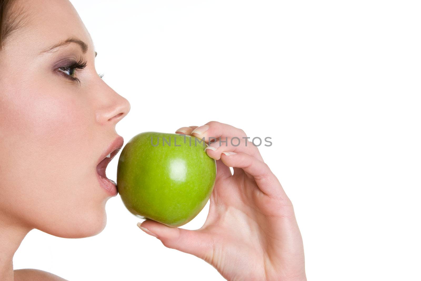 Woman eating green apple