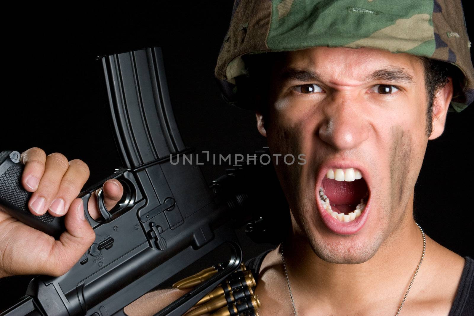 Angry military soldier holding gun