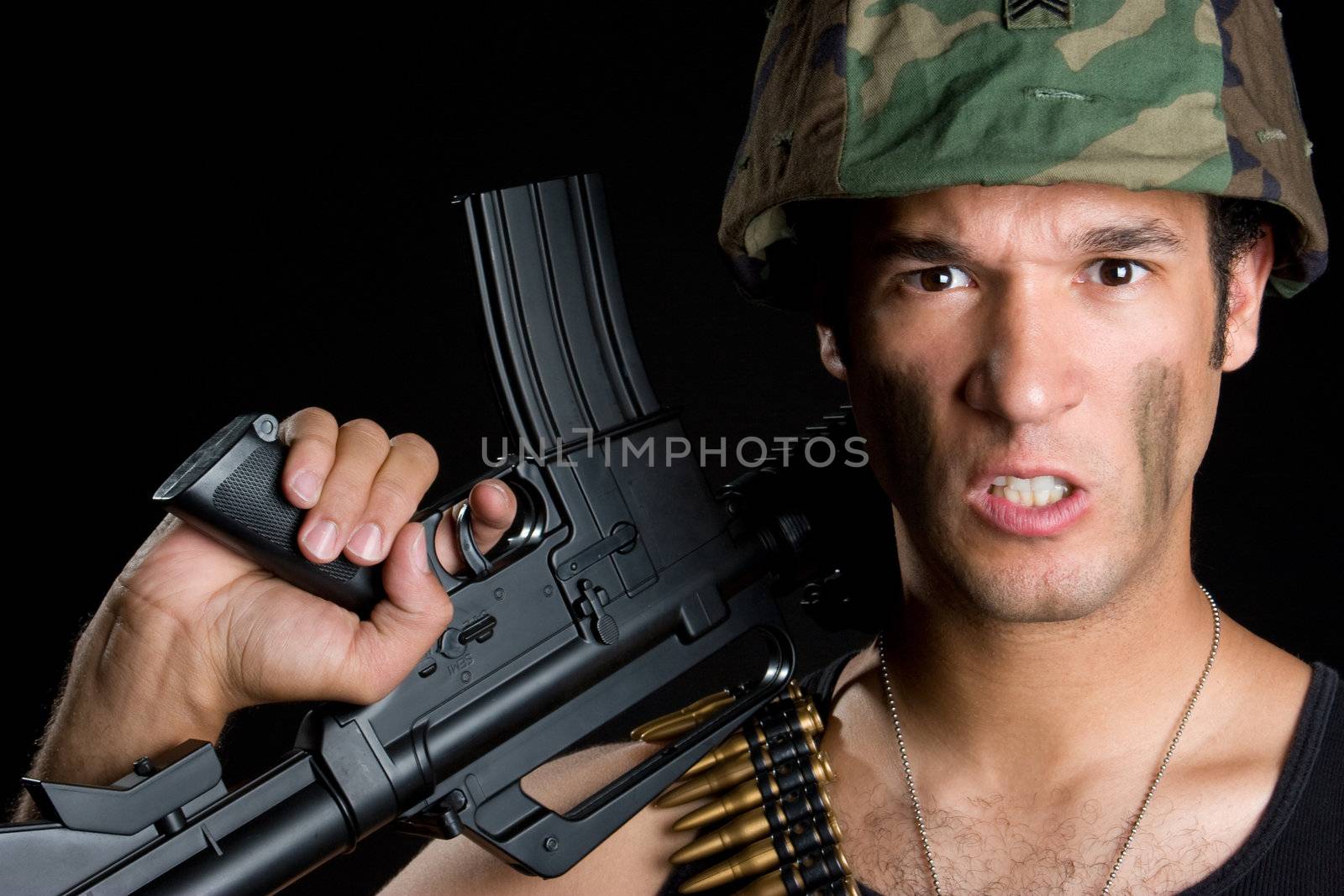 Aggressive soldier man holding gun
