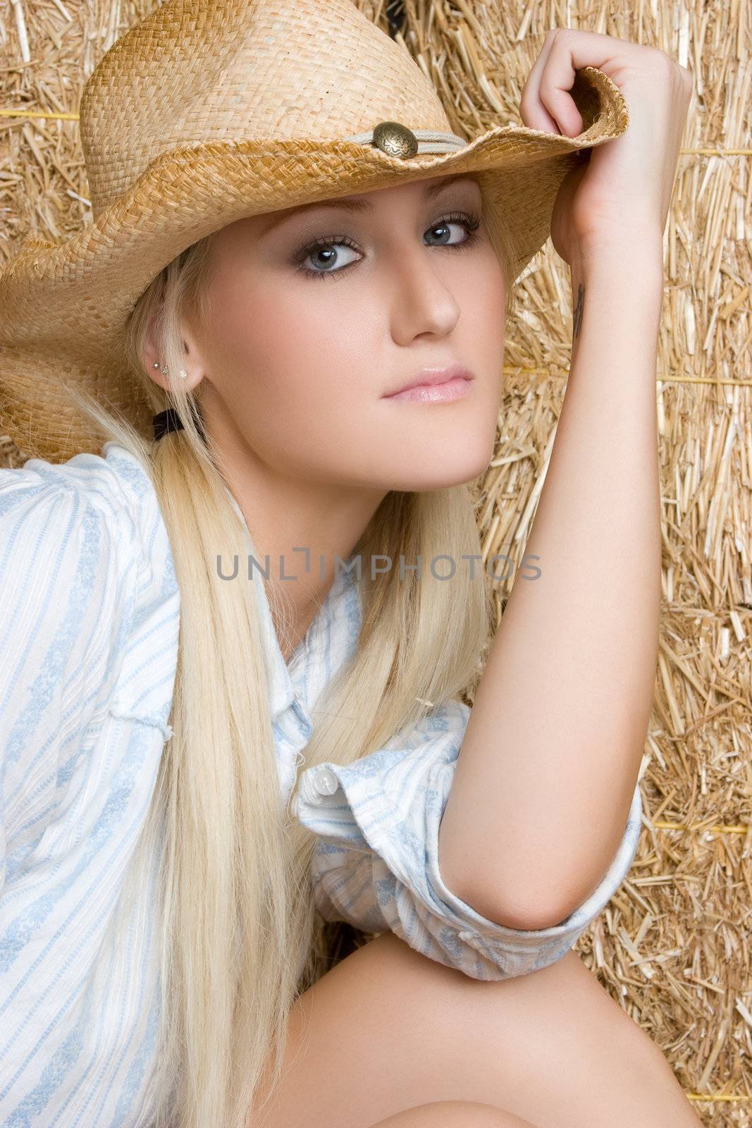 Pretty cowgirl wearing hat