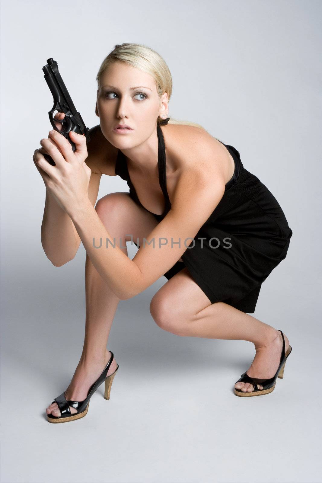 Sexy girl holding gun