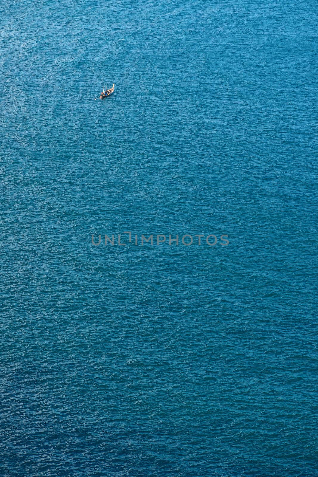 Single boat in the blue tranquil sea