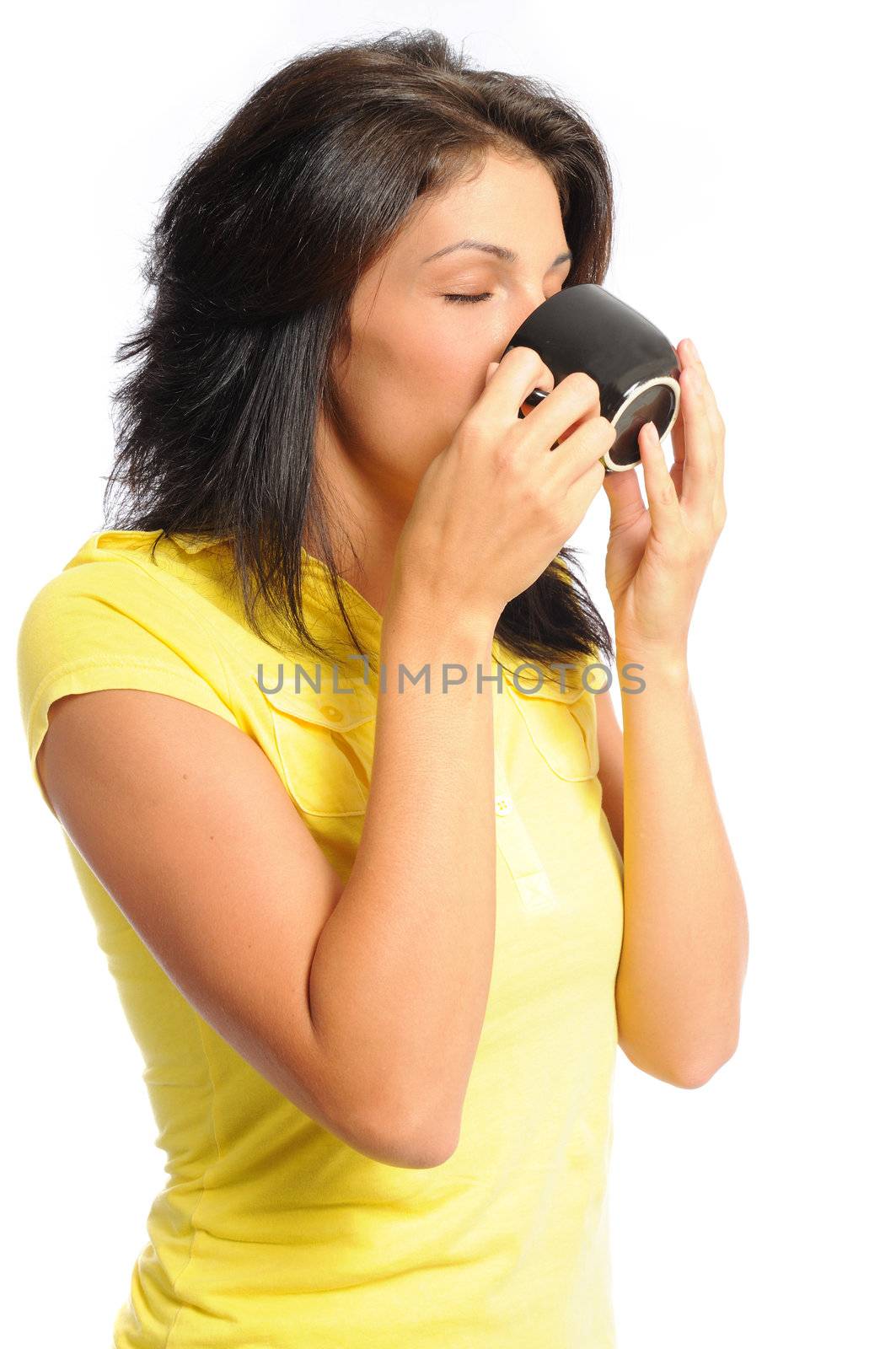 attractive young hispanic woman drinking a cup of coffee on a white background