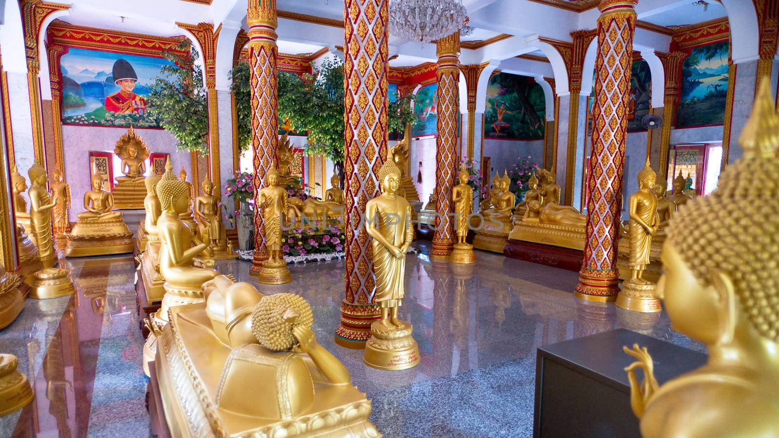Hall with statues of Buddha in buddhist temple, Thailand