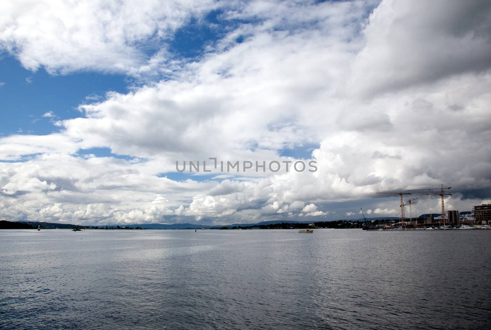 dramatic cloudscape in the harbor of Oslo Norway