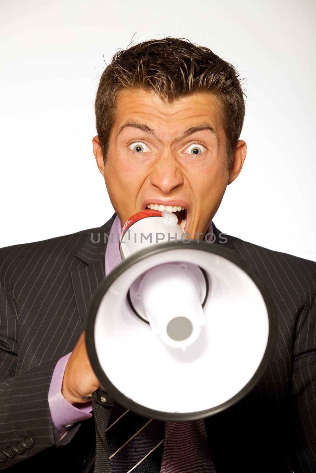 Businessman shouting through megaphone