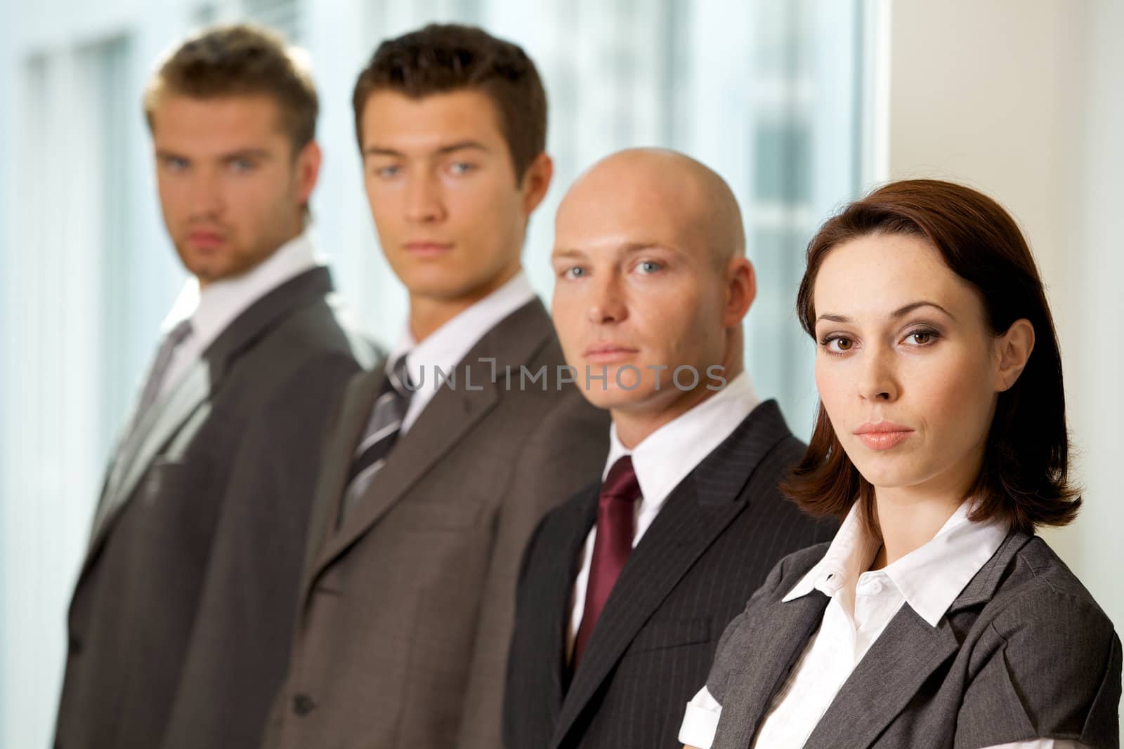 Portrait of young caucasian business people in office