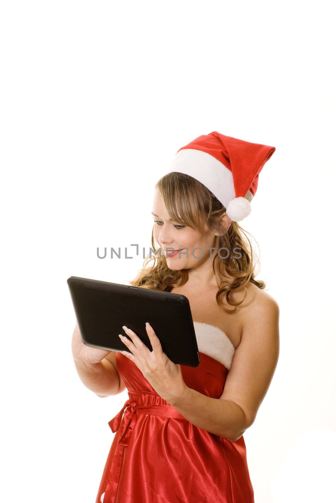 Woman in christmas outfit holding tablet computer isolated on white