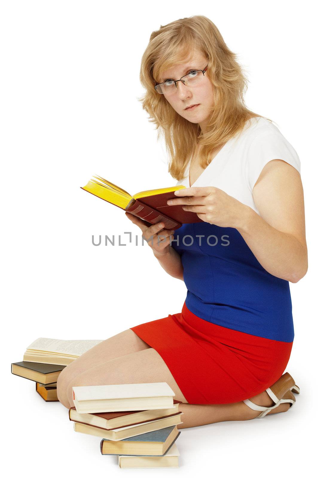 A young girl - a student reads a books