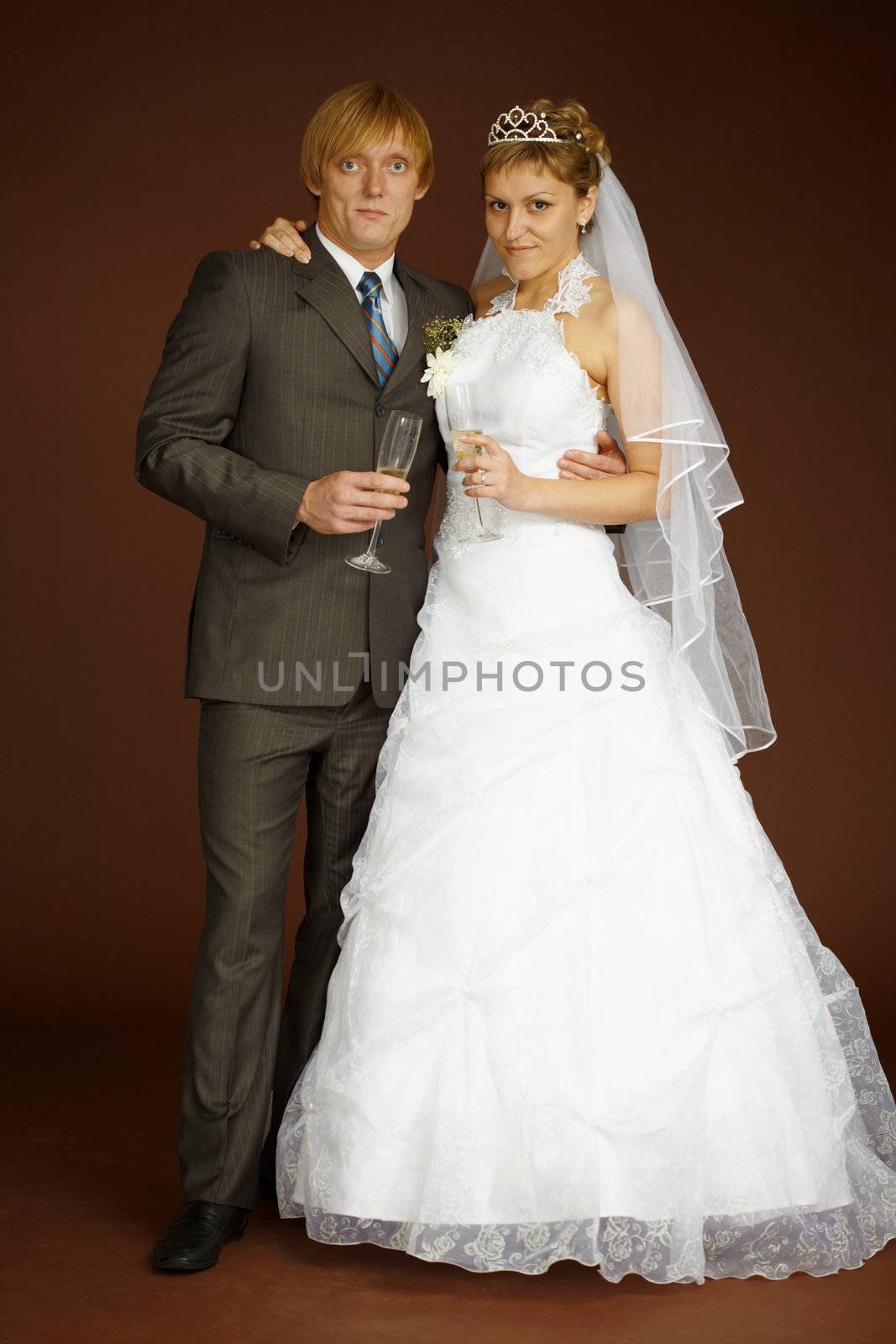 Studio portrait of groom and bride by pzaxe