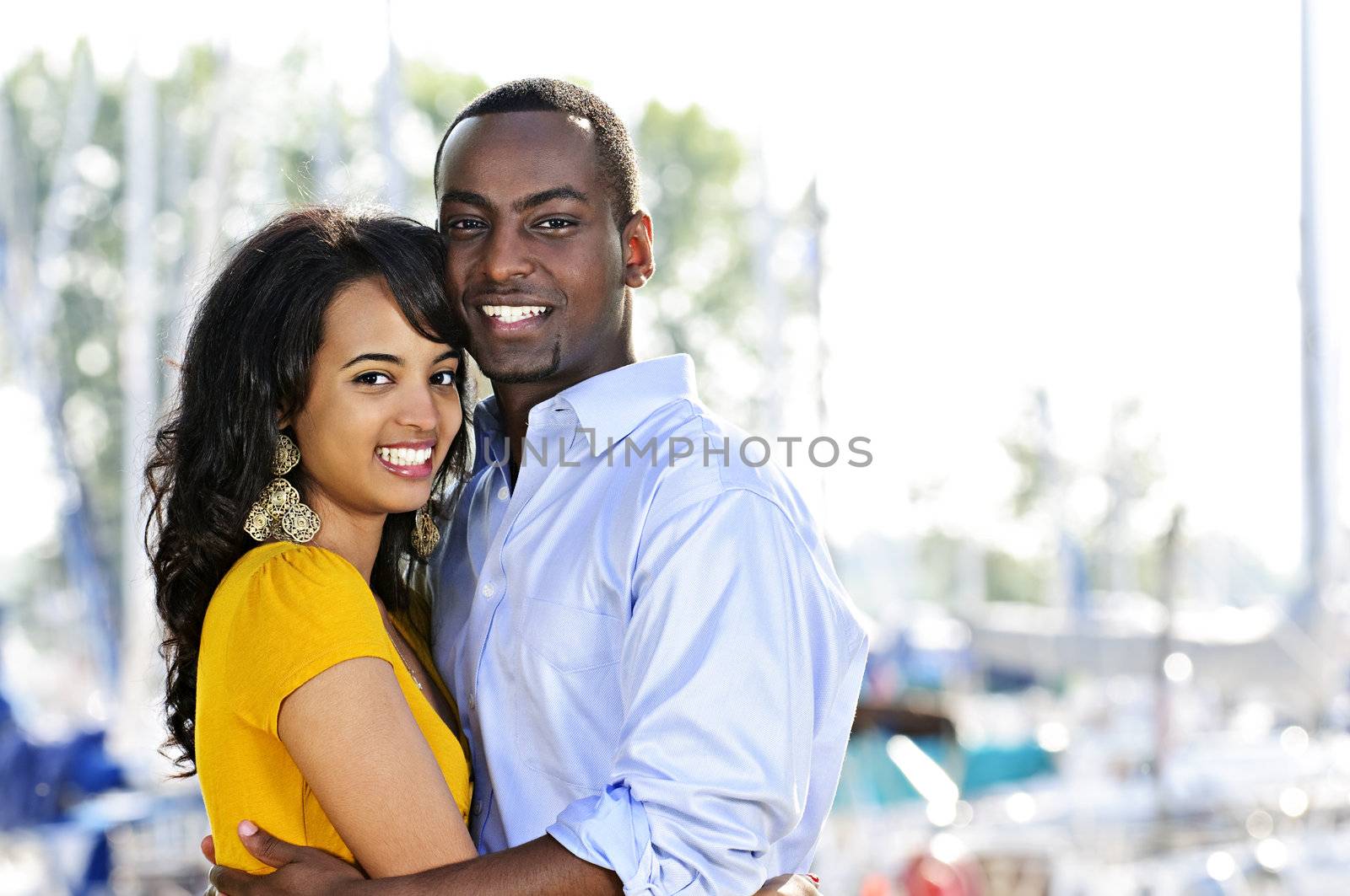 Happy couple embracing by elenathewise