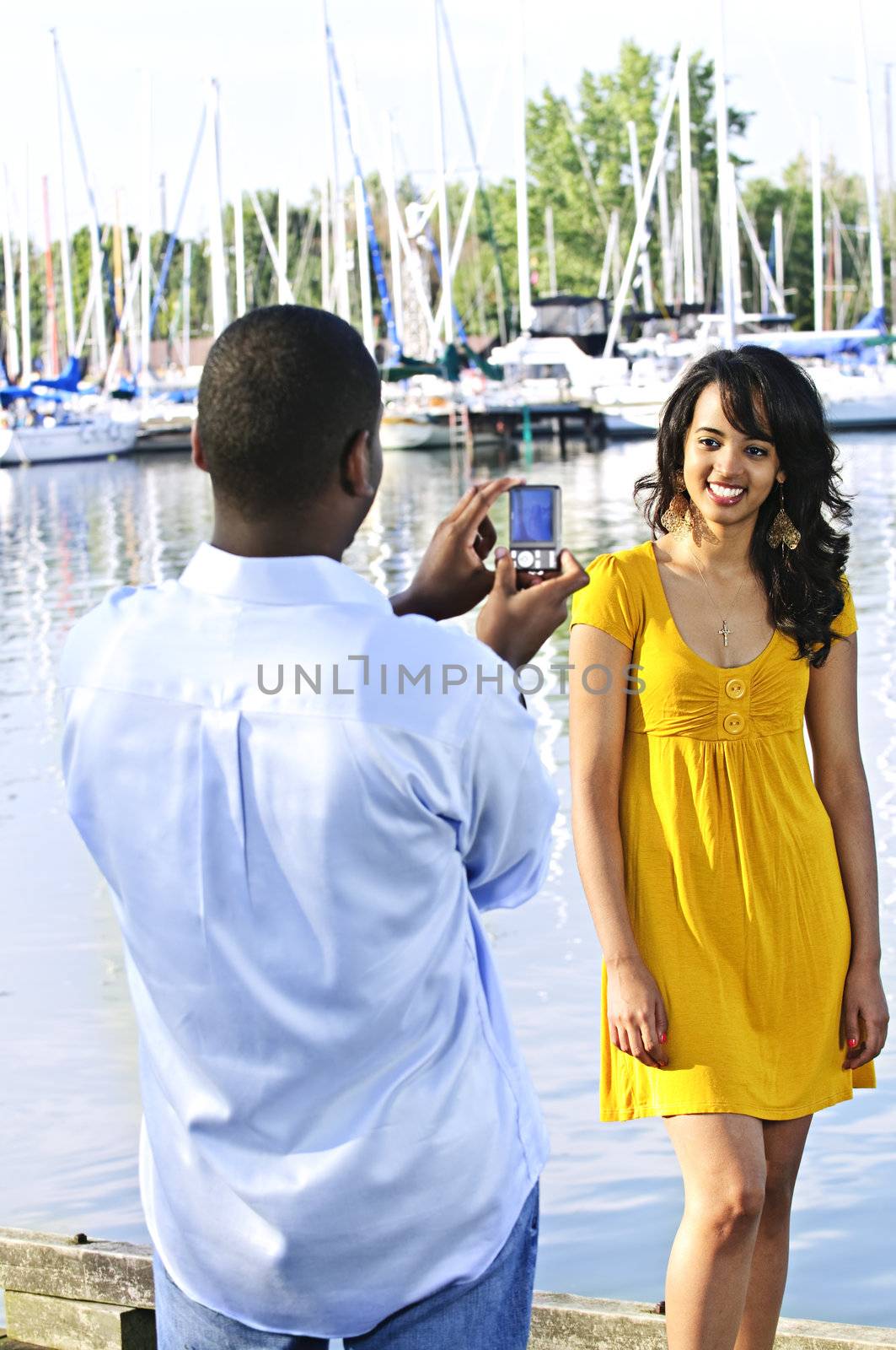 Woman posing for picture near boats by elenathewise