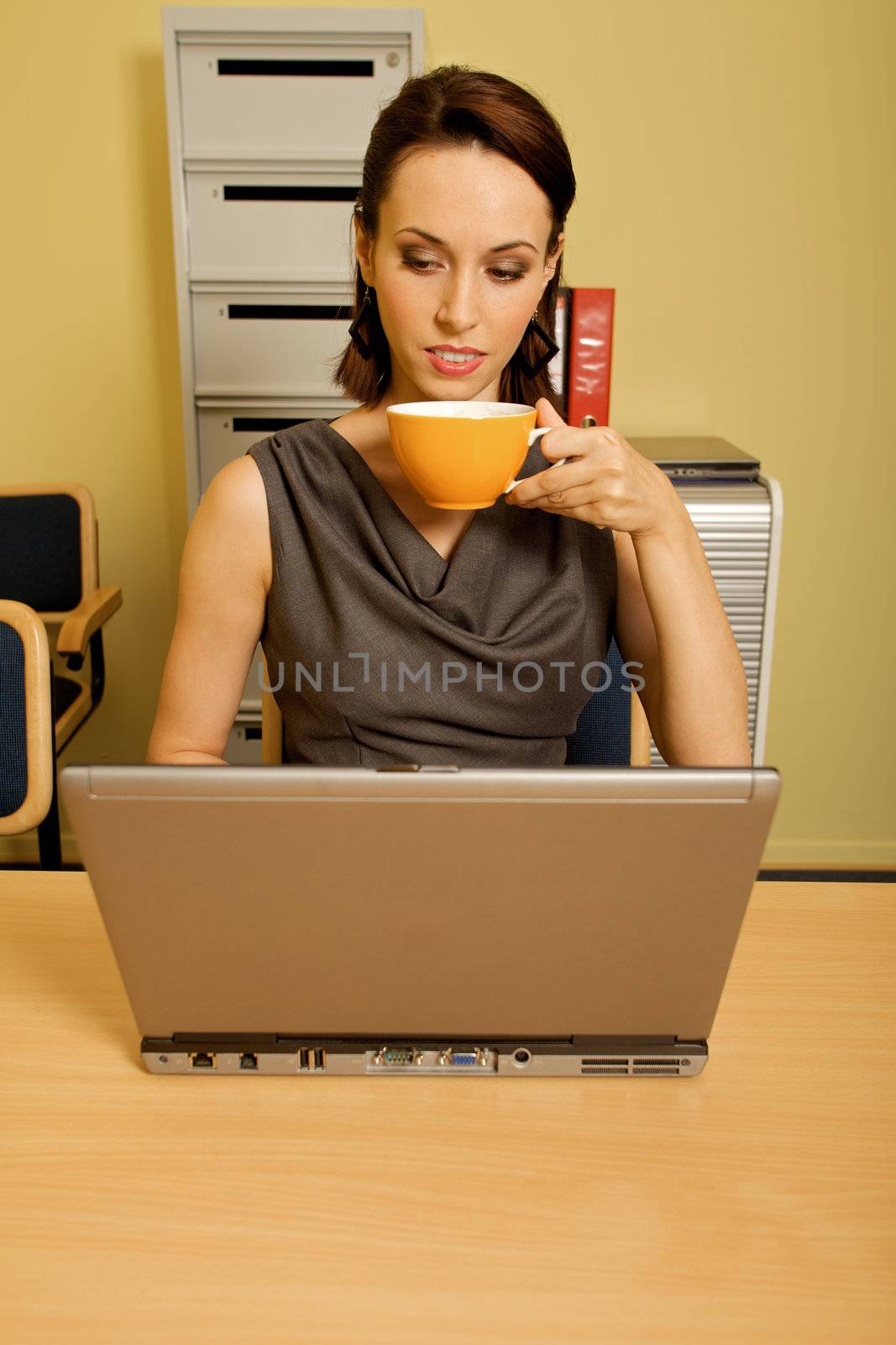 Portrait of businesswoman with arms crossed at office