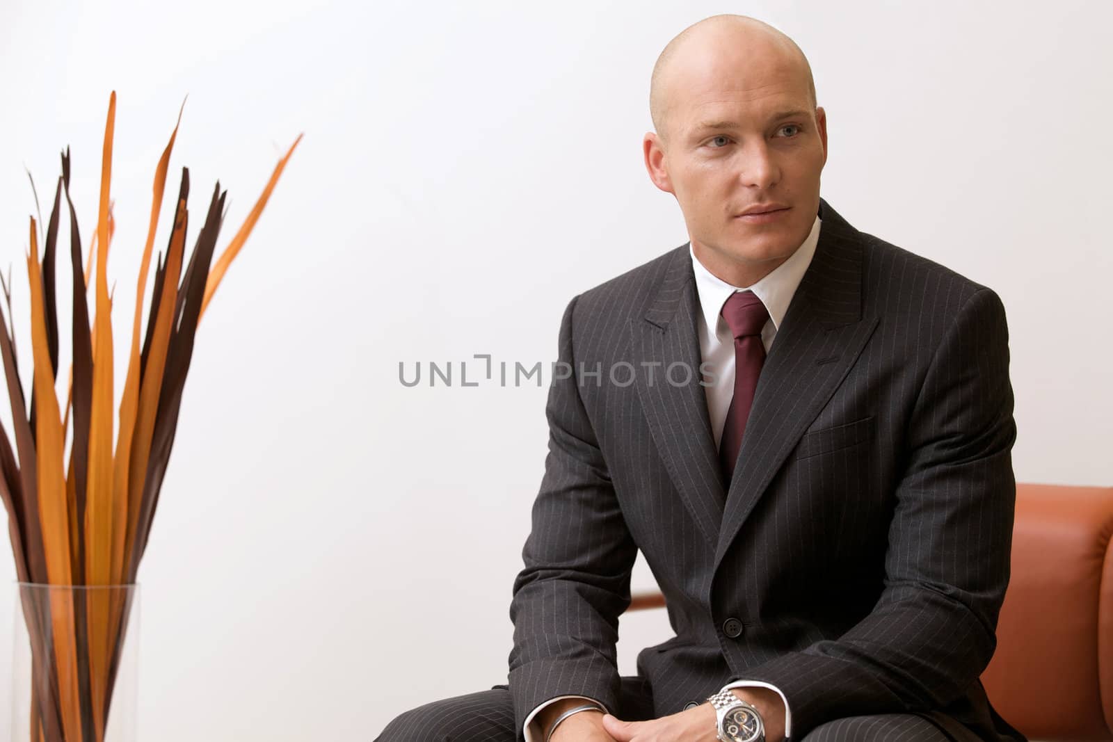 Portrait of young caucasian businessman in office