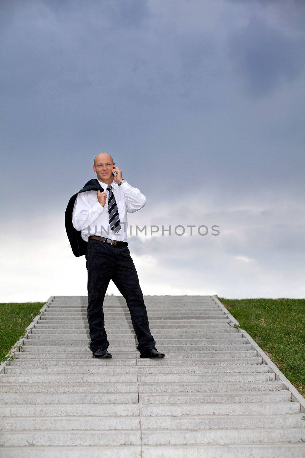 Businessman conversing on mobile phone
