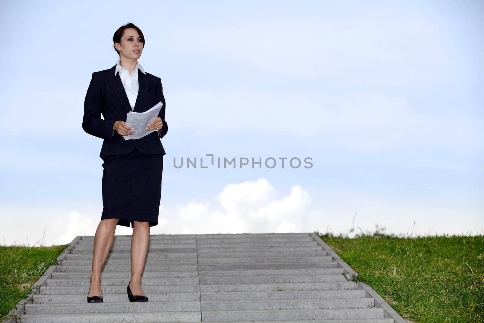 Businesswoman holding papers