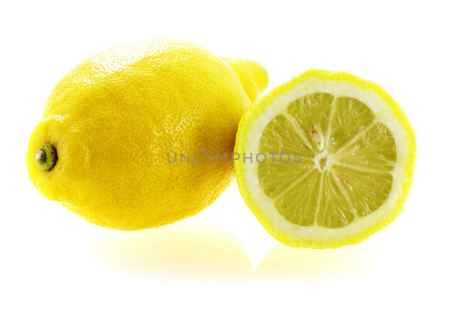 fresh ripe lemon with a slice over white background