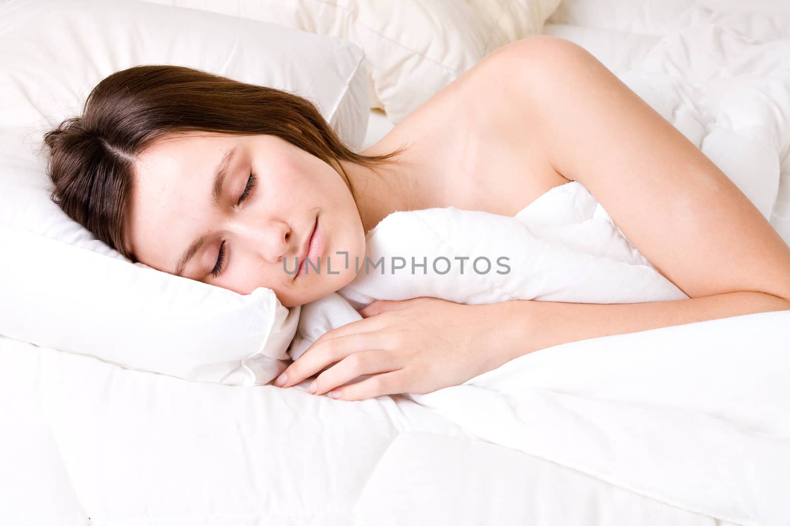 Young awe woman in sleeping in a bed