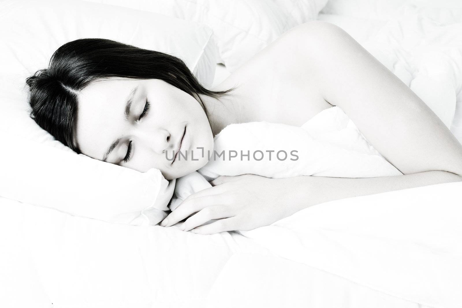 Young awe woman in sleeping in a bed