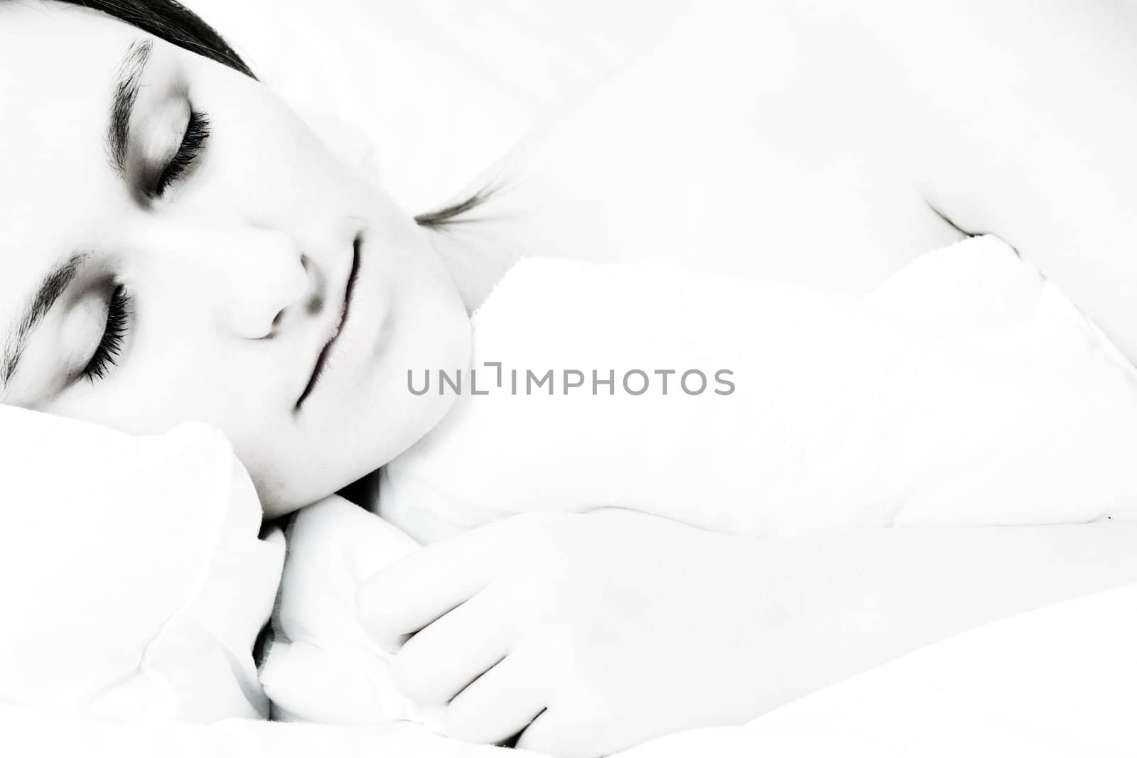 Young awe woman in sleeping in a bed