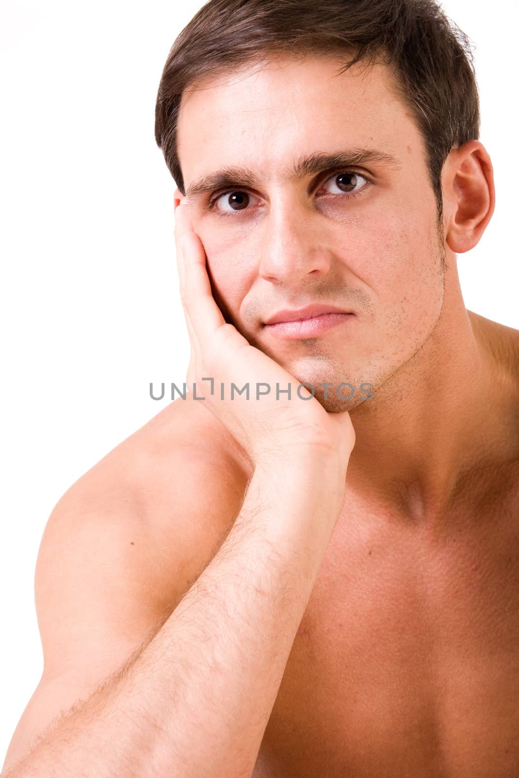 Young man portrait in the studio on a white background