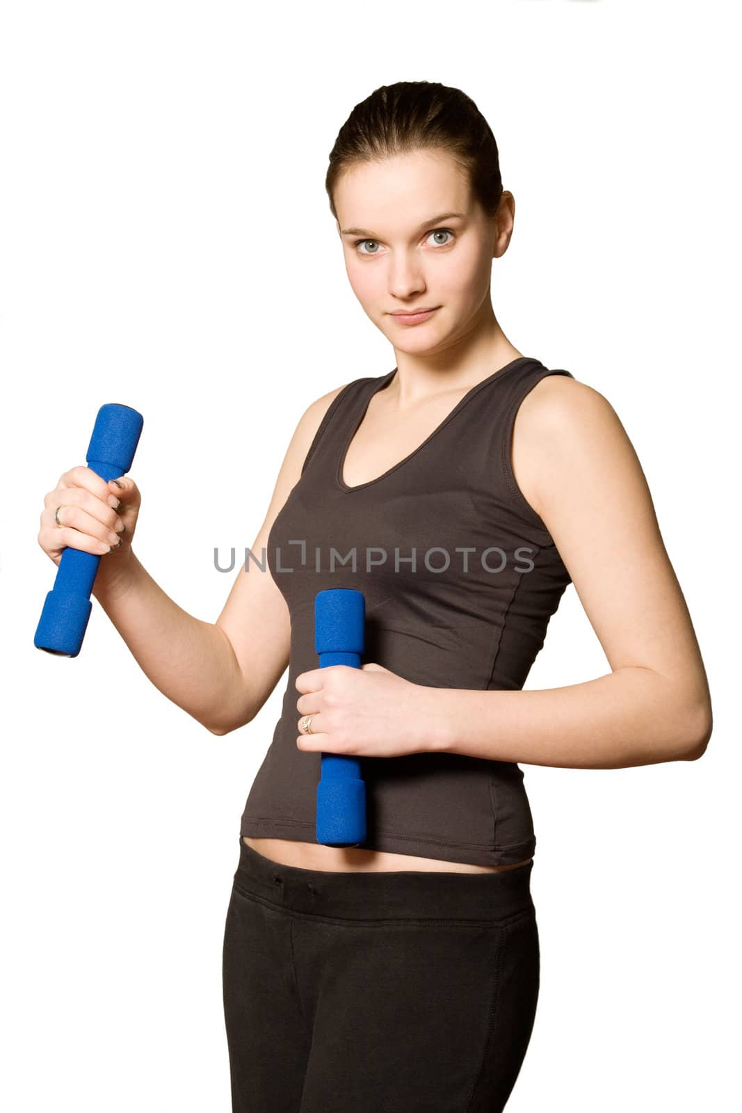 Young girl is sporting in the studio on a white background