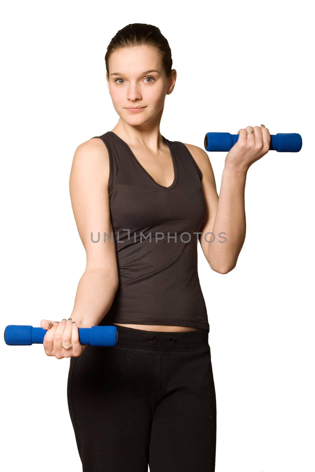 Young girl is sporting in the studio on a white background