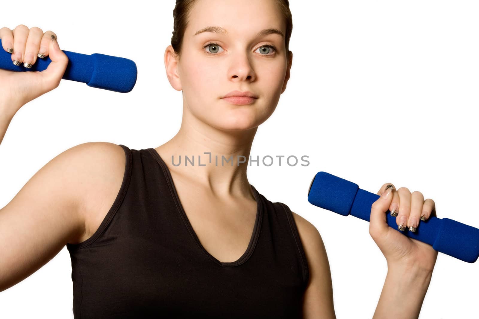 Young girl is sporting in the studio on a white background