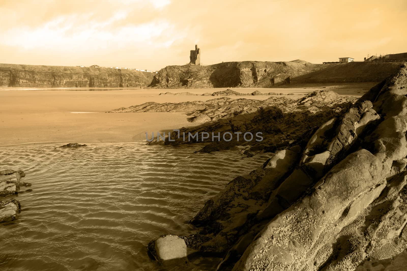 a rocky beach on a warm day with a calm sea an ideal place to have a walk in ireland