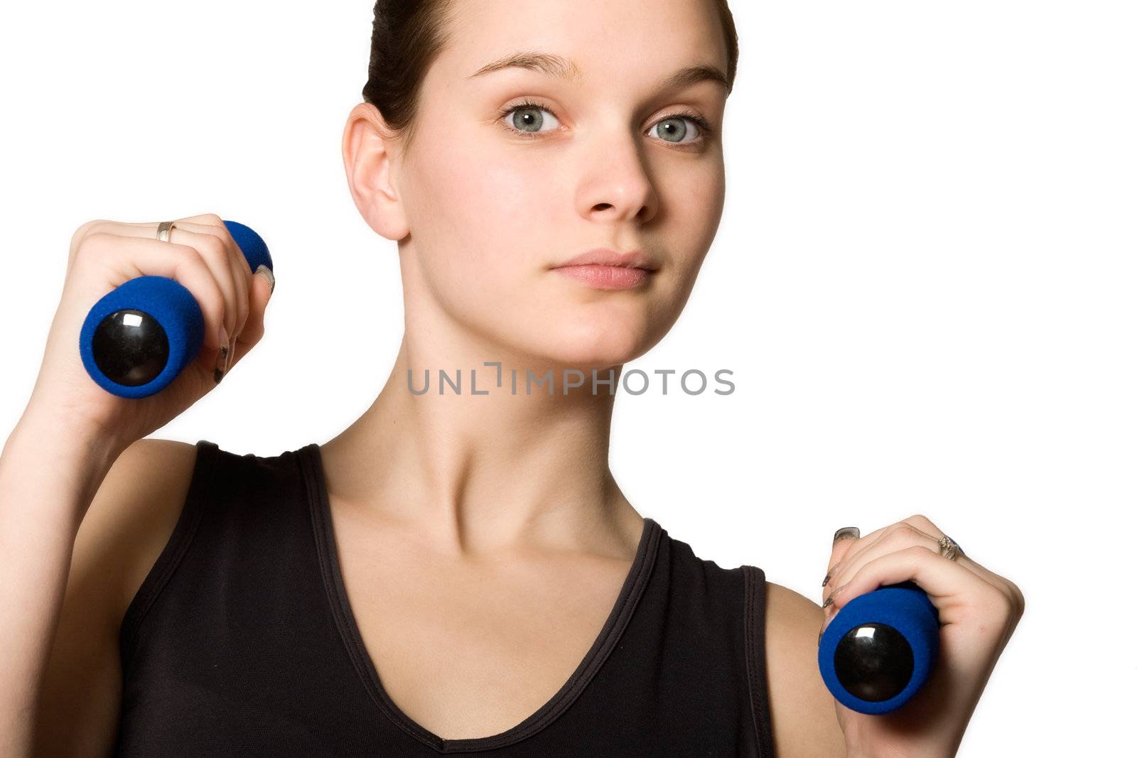 Young girl is sporting in the studio on a white background