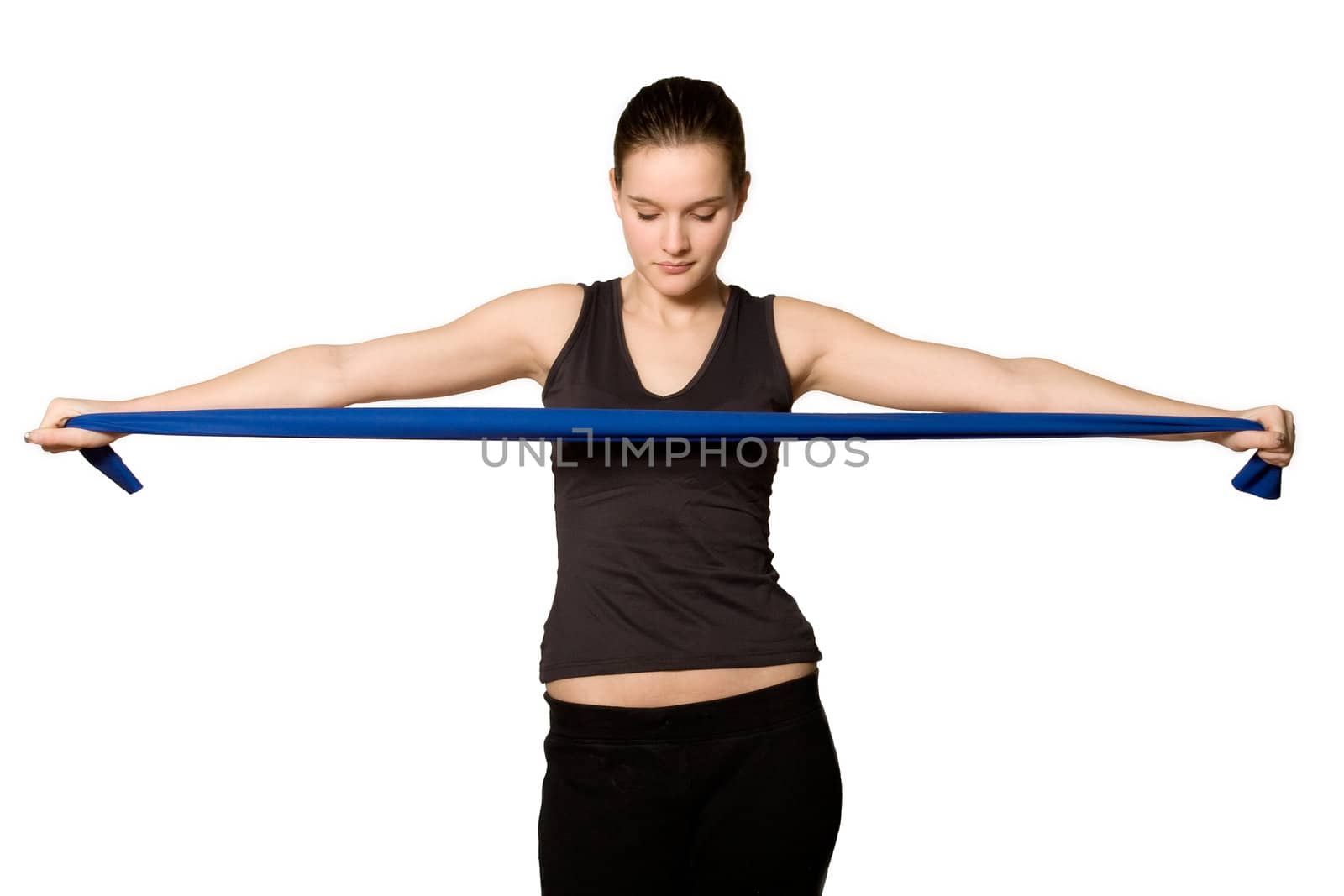 Young girl is sporting in the studio on a white background