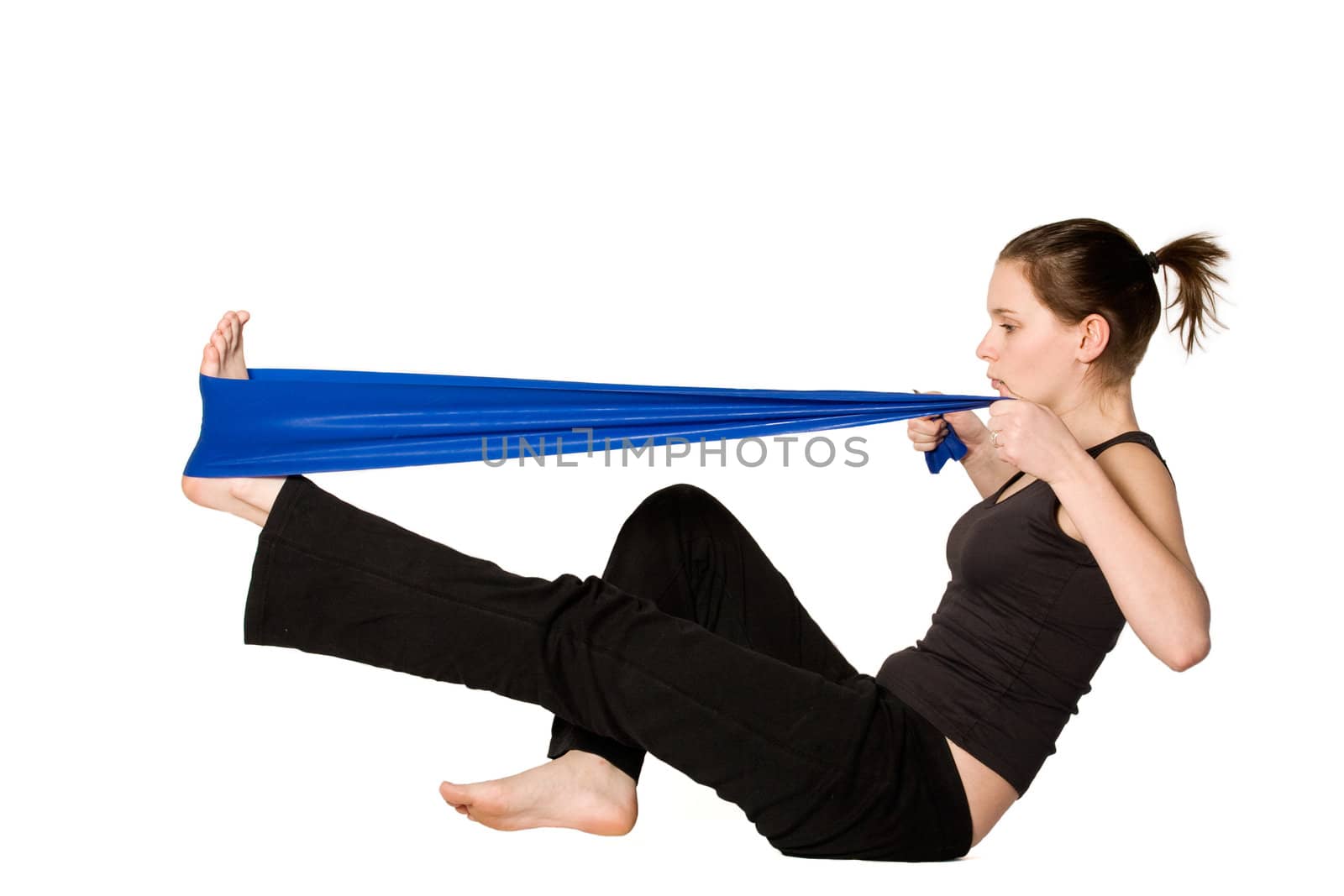 Young girl is sporting in the studio on a white background