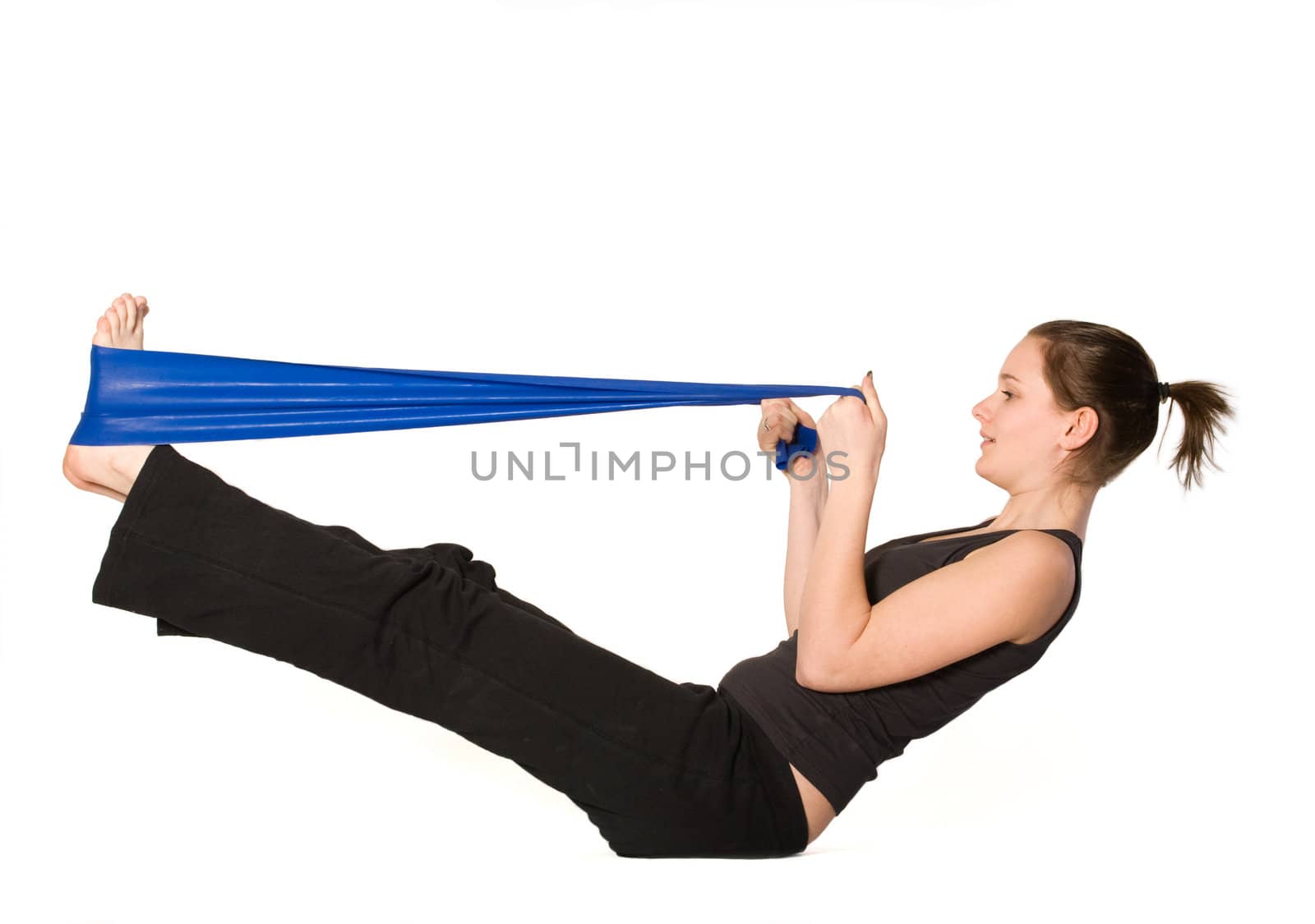 Woman is stretching her legs with a Resistance Band by DNFStyle