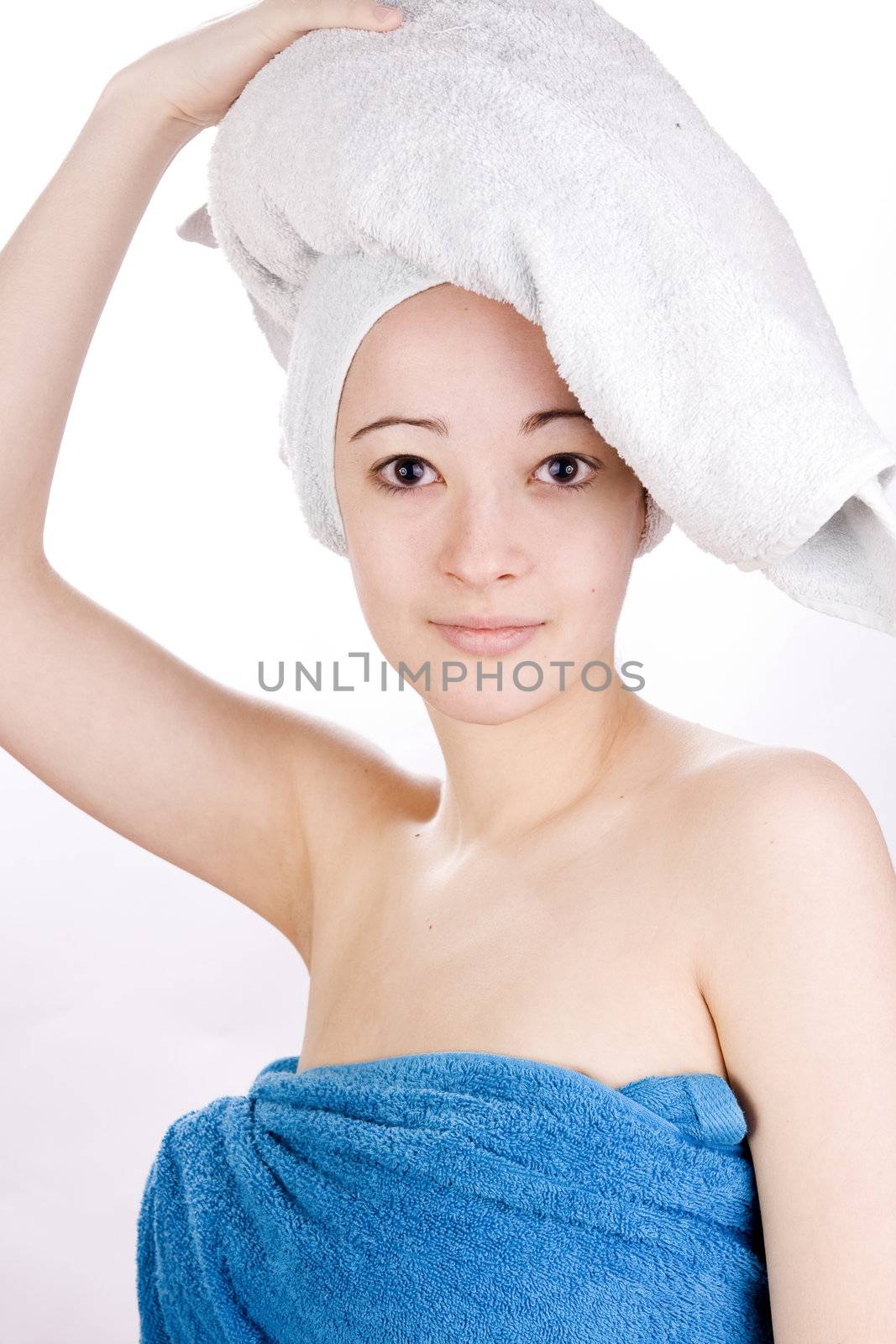 Young woman looking with a towel on her head