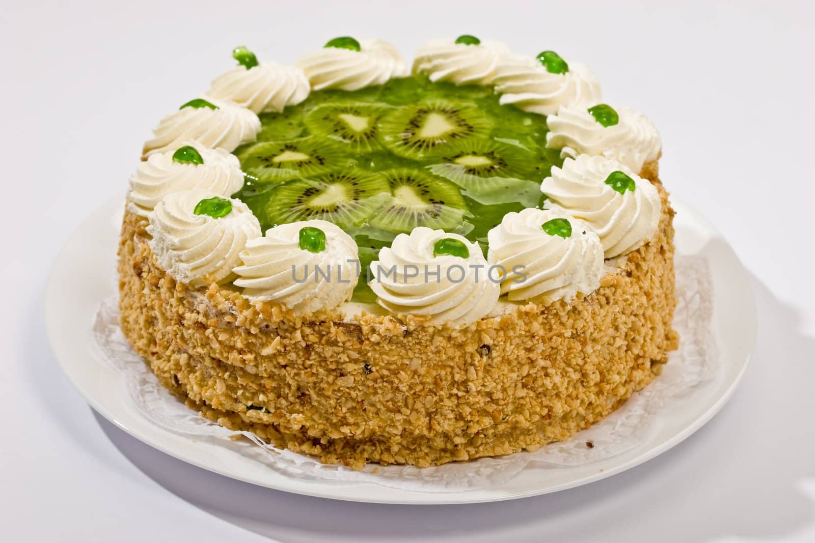 Bisquit cake with  kiwi fruit on the plate