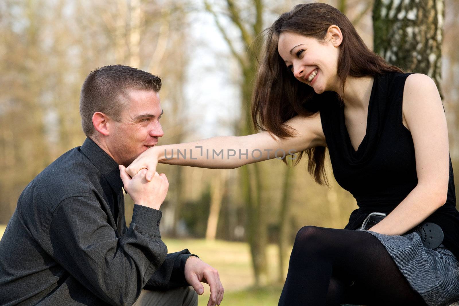 Young man kissing her hand by DNFStyle