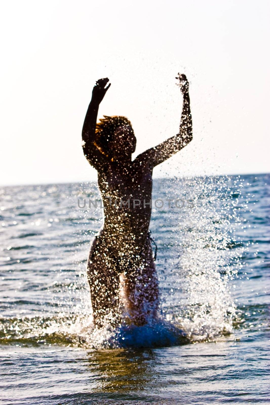leisure series: woman in sea water splashes